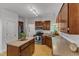 Bright kitchen with stainless steel appliances and wooden cabinetry at 24 W Canterbury Ct, Wendell, NC 27591