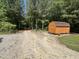 Barn in the woods with a long gravel driveway at 2483 Mcneill Hobbs Rd, Bunnlevel, NC 28323