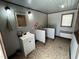Relaxing bathroom with a vanity, decorative mirror, and private bathing/grooming stations at 2483 Mcneill Hobbs Rd, Bunnlevel, NC 28323