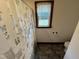 The bathroom has a patterned shower curtain and a window at 2483 Mcneill Hobbs Rd, Bunnlevel, NC 28323