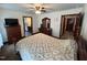 Cozy bedroom featuring carpet floors, a ceiling fan, and warm neutral tones at 2483 Mcneill Hobbs Rd, Bunnlevel, NC 28323