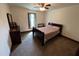 Inviting bedroom featuring a ceiling fan, neutral walls, and comfortable furniture at 2483 Mcneill Hobbs Rd, Bunnlevel, NC 28323
