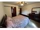 Comfortable bedroom featuring a ceiling fan, neutral walls, and closet with sliding door at 2483 Mcneill Hobbs Rd, Bunnlevel, NC 28323
