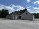 This home has a large front yard and a covered entryway at 2483 Mcneill Hobbs Rd, Bunnlevel, NC 28323
