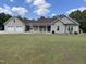 Charming single-story home with a two-car garage, front porch, well-manicured lawn, and inviting curb appeal at 2483 Mcneill Hobbs Rd, Bunnlevel, NC 28323