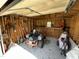 Well-organized garage interior with lawn equipment, tools, and ample storage space at 2483 Mcneill Hobbs Rd, Bunnlevel, NC 28323