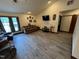 Bright living room with a vaulted ceiling, tile flooring and comfortable furnishings at 2483 Mcneill Hobbs Rd, Bunnlevel, NC 28323