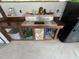 A functional outdoor kitchen sink with wood countertop and stone accent wall complements a full-sized refrigerator at 2483 Mcneill Hobbs Rd, Bunnlevel, NC 28323