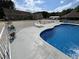 Beautiful backyard pool surrounded by a white fence and lounge chairs in a relaxing setting at 2483 Mcneill Hobbs Rd, Bunnlevel, NC 28323