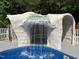 Amazing detail of a stone-like grotto with a built-in waterfall cascading into the sparkling swimming pool at 2483 Mcneill Hobbs Rd, Bunnlevel, NC 28323