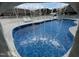 Unique view of a custom pool waterfall feature that enhances the backyard oasis at 2483 Mcneill Hobbs Rd, Bunnlevel, NC 28323