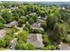 The aerial neighborhood view features lush greenery, community streets, and well-kept homes in a tranquil setting at 2536 Bent Green St, Raleigh, NC 27614