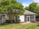 Backyard view showcasing the screened porch, mature trees, and well-maintained landscaping at 2536 Bent Green St, Raleigh, NC 27614
