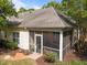 Rear exterior view showing the screened porch and landscaped backyard at 2536 Bent Green St, Raleigh, NC 27614
