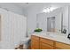 Well-lit bathroom with a vanity, mirror, and shower with a curtain at 2536 Bent Green St, Raleigh, NC 27614