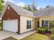 Charming home with a brick and siding exterior, well-manicured lawn, and a two-car garage at 2536 Bent Green St, Raleigh, NC 27614
