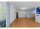 Spacious living room with hardwood floors, decorative lighting, and a glass door leading to the patio at 2536 Bent Green St, Raleigh, NC 27614