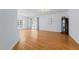 Spacious living room with hardwood floors, decorative lighting, and a glass door leading to the patio at 2536 Bent Green St, Raleigh, NC 27614