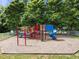 Community playground with colorful play structures and a soft wood chip surface at 2536 Bent Green St, Raleigh, NC 27614