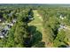 Aerial view showing a golf course and the surrounding residential neighborhood at 266 Hogans Valley Way, Cary, NC 27513