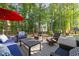 Outdoor deck features ample seating and views of a lush backyard at 266 Hogans Valley Way, Cary, NC 27513