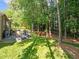Spacious backyard with patio seating, a grill, and plenty of room to play at 266 Hogans Valley Way, Cary, NC 27513