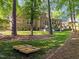 Expansive backyard with mature trees, a large lawn, and entertainment spaces at 266 Hogans Valley Way, Cary, NC 27513