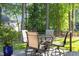 Backyard patio featuring a table and seating, overlooking the green lawn at 266 Hogans Valley Way, Cary, NC 27513