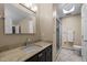 Well-lit bathroom with tile floor, granite countertops, and a glass-enclosed shower at 266 Hogans Valley Way, Cary, NC 27513