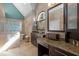 Bright bathroom boasts dual sinks, granite counters, decorative stone, tub and lots of natural light at 266 Hogans Valley Way, Cary, NC 27513