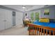 Cozy bedroom features light blue walls, desk area, ceiling fan and carpet flooring at 266 Hogans Valley Way, Cary, NC 27513