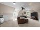 Bright bonus room offers a comfortable seating area, mounted TV, and natural light at 266 Hogans Valley Way, Cary, NC 27513