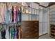 Custom walk-in closet with ample shelving, drawer storage, and hanging space for organization at 266 Hogans Valley Way, Cary, NC 27513