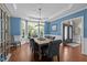 Formal dining room with blue walls, wainscoting, crown molding, and an elegant chandelier at 266 Hogans Valley Way, Cary, NC 27513