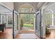 Grand foyer showcasing hardwood floors, arched entryway, and views of the front yard at 266 Hogans Valley Way, Cary, NC 27513