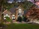 Elegant brick home with lush landscaping, providing a welcoming and serene atmosphere at 266 Hogans Valley Way, Cary, NC 27513