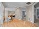 Upstairs landing with hardwood flooring, staircase railing, and open doorway to a bedroom at 266 Hogans Valley Way, Cary, NC 27513