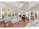 Spacious living room with large windows, hardwood floors, and comfortable seating at 266 Hogans Valley Way, Cary, NC 27513