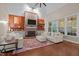 Inviting living room with brick fireplace, wood paneling, and comfortable seating area at 266 Hogans Valley Way, Cary, NC 27513