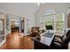 Spacious office featuring hardwood floors, a large window, and an adjacent formal dining area at 266 Hogans Valley Way, Cary, NC 27513