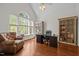 Bright office space with a large arched window, hardwood floors, and custom built-in shelving at 266 Hogans Valley Way, Cary, NC 27513