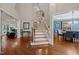 Elegant staircase with wood and iron railings connecting the home's multiple levels at 266 Hogans Valley Way, Cary, NC 27513