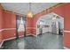Dining room view with colorful accent walls and decorative chandelier at 2719 S Nc 87, Graham, NC 27253