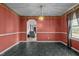 Dining room featuring colorful accent walls, and a decorative chandelier at 2719 S Nc 87, Graham, NC 27253
