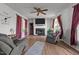 Comfortable living room featuring a fireplace and modern decor at 2719 S Nc 87, Graham, NC 27253