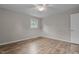 Bedroom with wood-look flooring and a ceiling fan at 305 W Old Rd, Lillington, NC 27546
