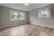 Bedroom with natural light and wood-look flooring at 305 W Old Rd, Lillington, NC 27546