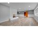 Bright living room with brick fireplace and modern wood-look floors at 305 W Old Rd, Lillington, NC 27546