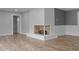 Inviting living room featuring brick fireplace and wood-look floors at 305 W Old Rd, Lillington, NC 27546