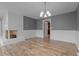 Spacious living room with a white brick fireplace and neutral paint throughout at 305 W Old Rd, Lillington, NC 27546